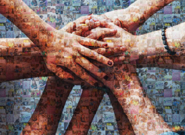 Close up top view of young people putting their hands together. Friends with stack of hands showing unity.